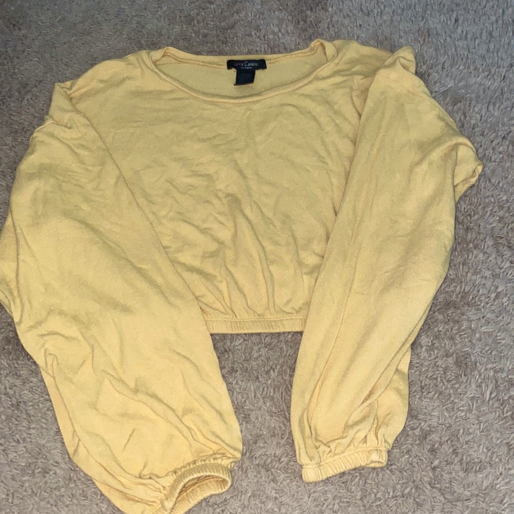 This is a comfortable, stretchy, yellow crop top that looks great for summer.